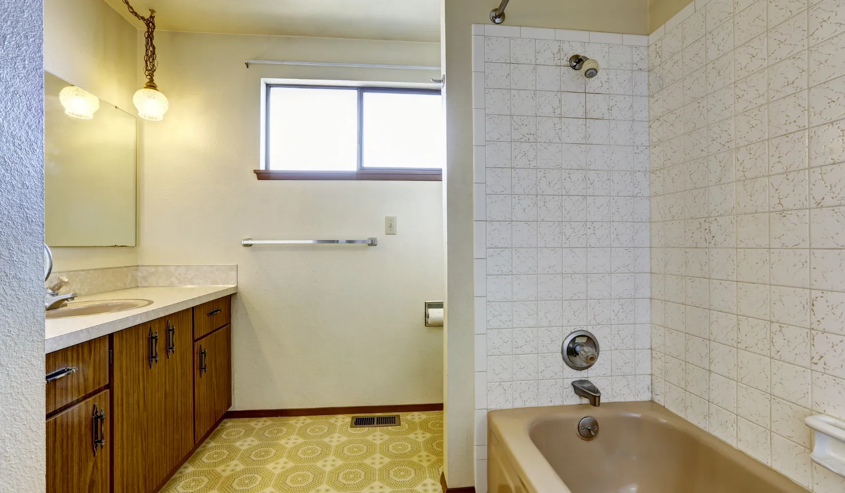 Bathroom remodeling project in Los Angeles with an outdated bathroom and tub