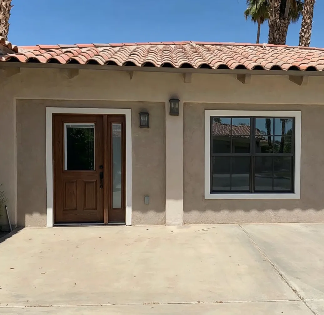 Garage conversion ADU in Los Angeles CA featuring finished exterior with new entry door and window installation