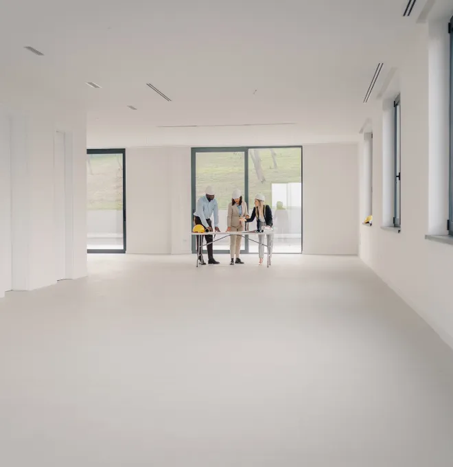 Commercial remodeling project planning in Los Angeles with construction team discussing interior renovation