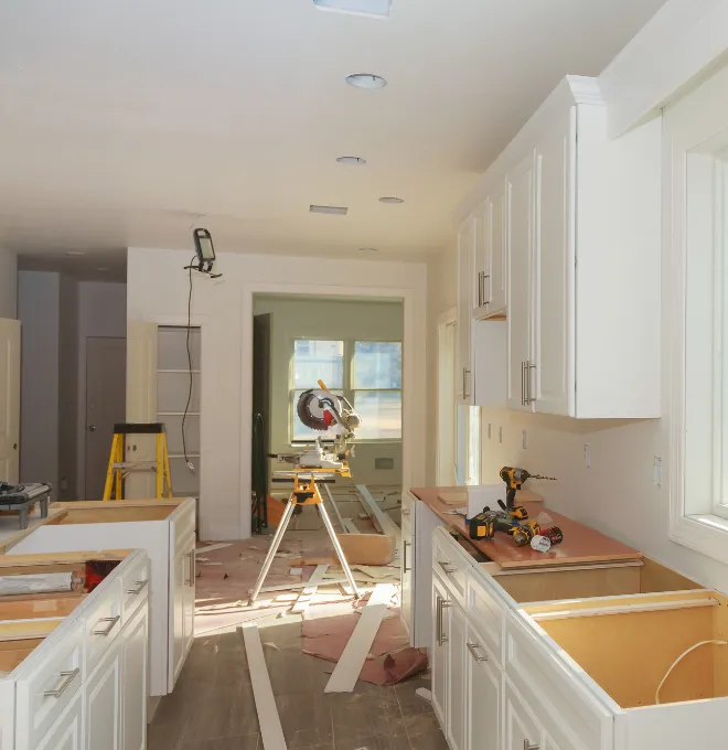 Kitchen remodeling in Los Angeles with cabinet installation on construction site