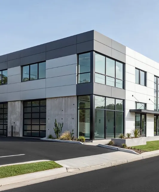 Commercial remodeling project in Los Angeles featuring modern office building with updated exterior facade, glass panels, and contemporary design